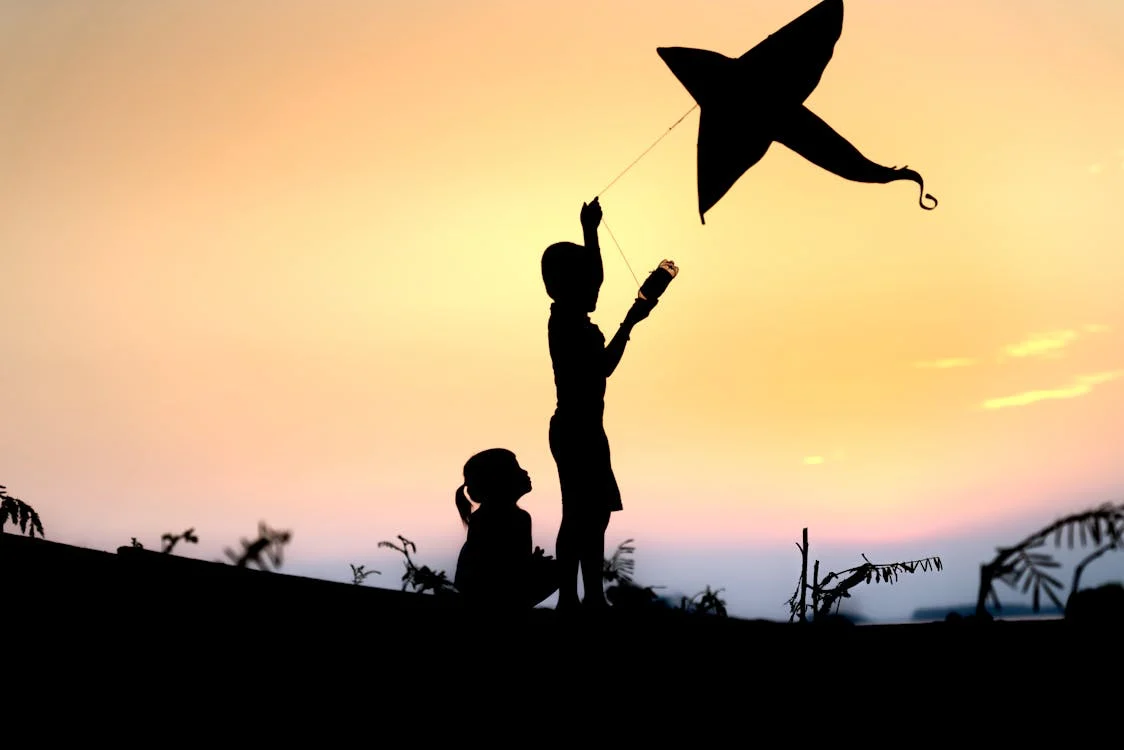 Kids playing with a kite